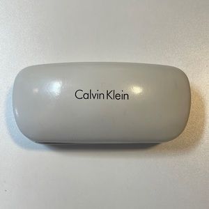 Calvin Klein white sunglasses case.